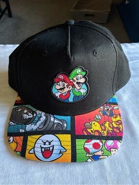 Nintendo Black Snapback Hat with Multicolor Mario Comic Brim